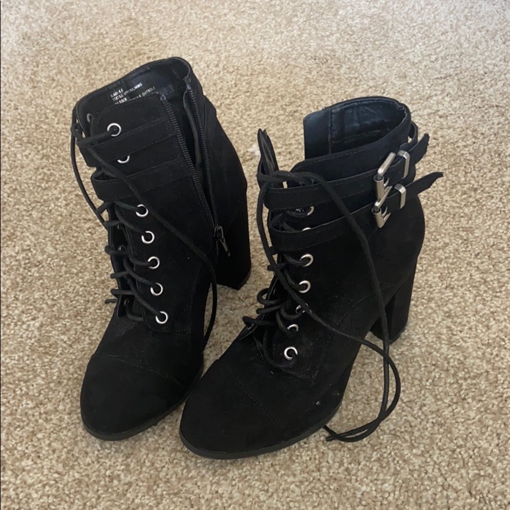 Madden Girl Black lace up heeled boot w/ buckles.